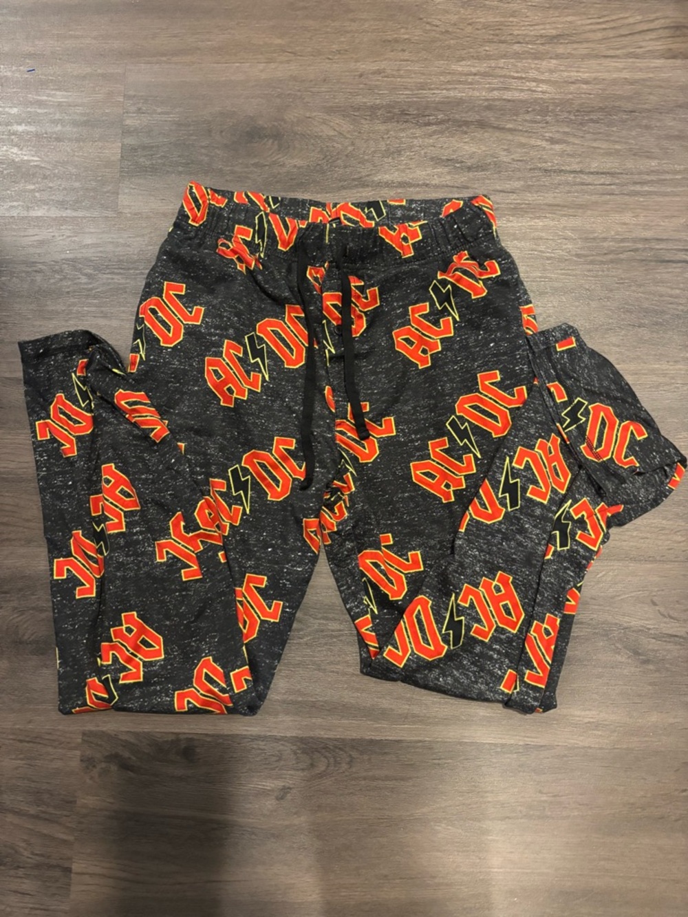 AC/DC Black Pants with Red and Yellow Band Print